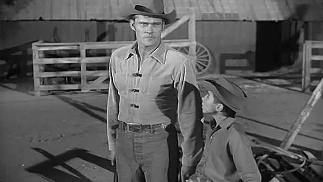 Black and white image of Chuck Connors and Johnny Crawford